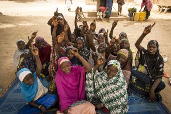 Group of girls with hands raised
