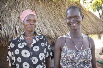 Two women standing next to each other