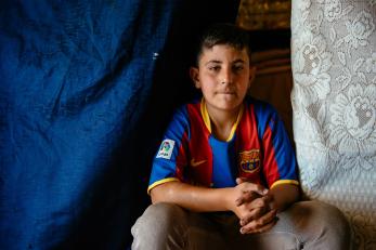 Hammoudi sitting with hands folded