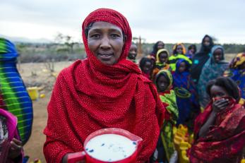 Dima is the sole provider for her eight children, and her livelihood, like that of her community near Yabello, Ethiopia, depends on cattle. Dima has learned to run a successful small business buying and selling milk. Photo: Sean Sheridan for Mercy Corps