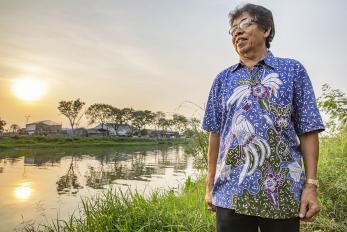 Man standing in front of a stream in indonesia