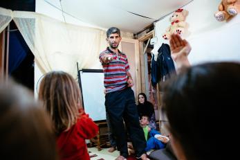 Ziad with his family teaching