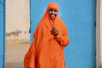 Woman wearing bright orange in Somalia
