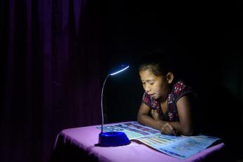 girl doing homework at desk