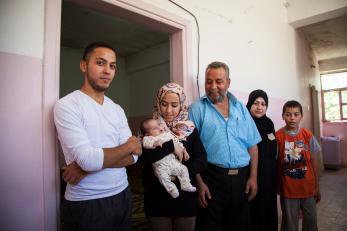 A man standing with his family members in jordan