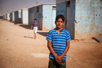 A boy in a blue shirt at zaatari camp