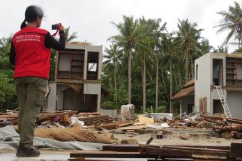 Mercy Corps team member taking a photo in Indonesia