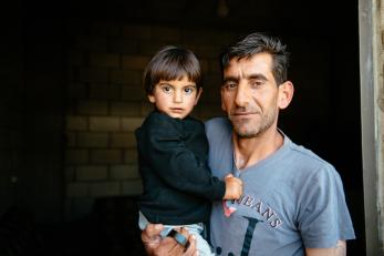 A man holding a young child