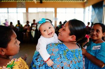 Woman with smiling baby in Guatemala
