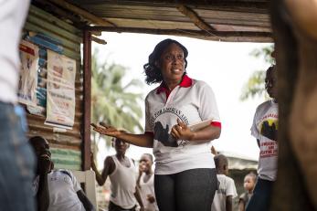 Community educators for the Centre for Liberian Assistance mobilize for community outreach on the dangers of Ebola. Photo: Sean Sheridan for Mercy Corps
