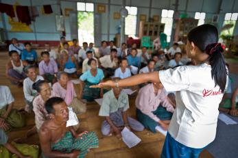 mercy corps team member speaking to community