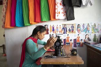 girl using sewing machine