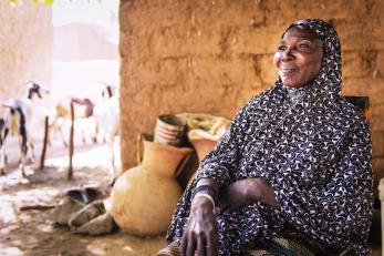 A woman in Niger smiling and looking into the distance