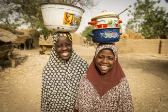 Friends Mariya and Badariya in Niger after participating in one of Mercy Corps' discussion groups for girls. Photo: Sean Sheridan for Mercy Corps