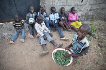 Eight children pictured in Nigeria. Their caretaker has struggled immensely to feed them with what she can grow and cultivate herself on land she pays to rent. Photo: Ezra Millstein/Mercy Corps