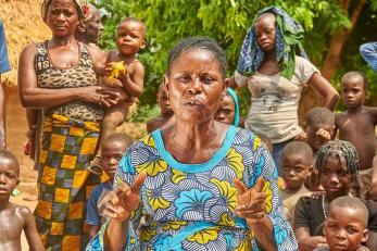 woman speaking to community