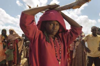 Girl in Somalia with red top and scarf