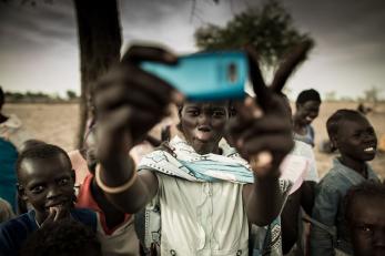 boy holding mobile phone