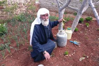 This farmer made pickled lettuce from his garden. Mercy Corps trains Syrian farmers to save the seeds from their vegetables to use again next season.