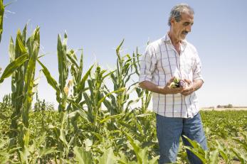 Abu Goubran pictured in a green field