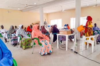 Nigeria classroom and Covid-19 prevention is being taught.