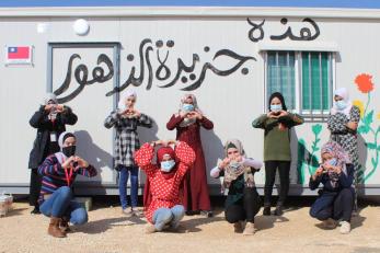 Women in Jordan making heart shapes with their hands