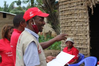 Mercy Corps representatives speaking together. 