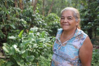 An image of Rosario Rodriguez, a second-generation coffee producer who helps lead her farmer co-op.