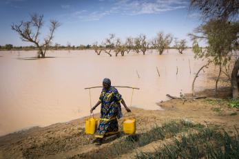 A person collecting water.