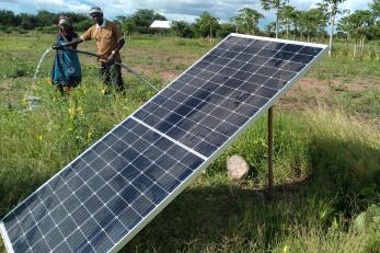 A subsistence farmer using a a solar water pump.