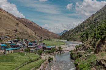 Agricultural river scene in a valley in Nepal.