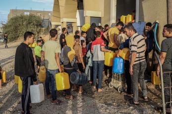 People queue to fetch water in the southern Gaza Strip city of Khan Younis, on Nov. 11, 2023. Photo by Rizek Abdeljawad/Xinhua via Getty Images