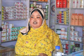A business owner tending to their shop.