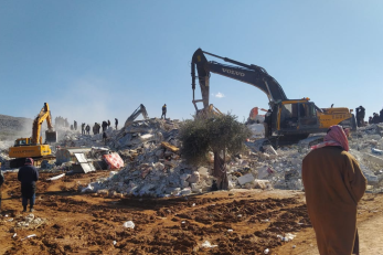 Earthquake responders working with debris.