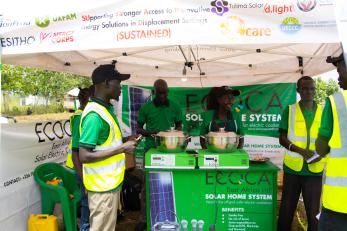 A partner in the SUSTAINED Program showcases its clean energy cooking solutions in BidiBidi
