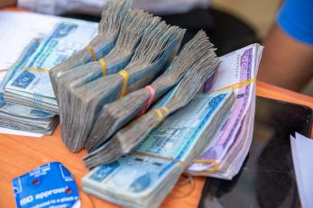 Bundles of currency on a table.