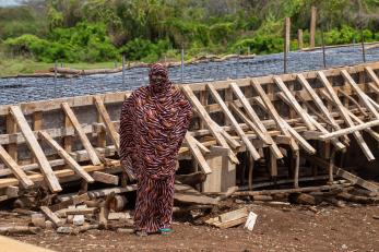 Woman standing in front of local infrastructure project.