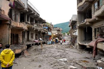 People assess damage in Rasuwa District, Bagmati Province in the wake of the devastating flood in northern Nepal.