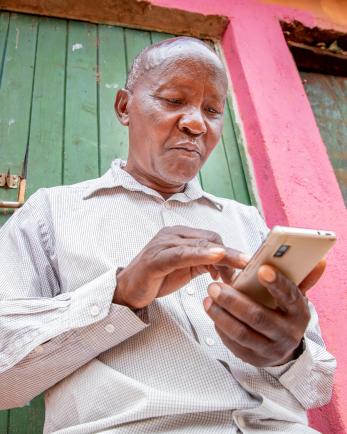 Kenyan man on his smartphone