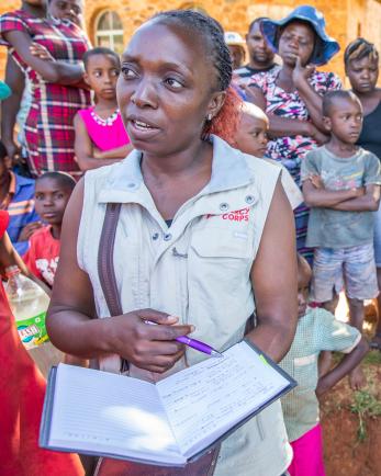 Mercy Corps team member in Zimbabwe with a group of people