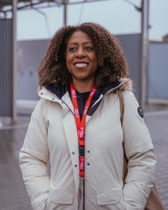 Image of Tjada D'Oyen McKenna meeting with people.