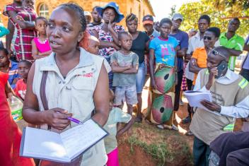 Mercy Corps’ Vimbayi Mazanhi helps to distribute jerrycans, water purification tablets, water storage buckets and soap to families taking shelter in a church in Ngangu, Zimbabwe.