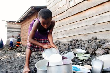 Angel ends the day washing the family's dishes, so they are ready to do it all over again tomorrow.