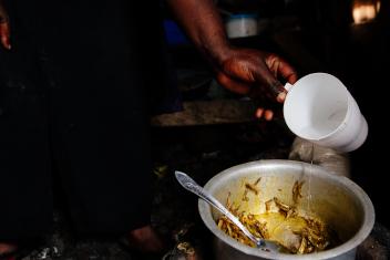 Beans and the leaves from pea shoots are common staples. But with a few extra francs, Justine is able to buy dried sambaza, a small sardine-like fish that's harvested from the lake. She needs some water to soak them before frying them in onions and oil.