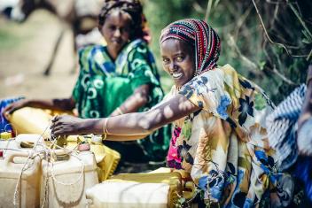 Transacting with the processing plant has brought them a more regular source of income. Before, they could only sell the milk to passersby on the road, which was inconsistent and unpredictable. Photo: Sean Sheridan for Mercy Corps