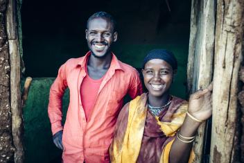 The pond has been life-changing for Abdi (left) and his wife, who used to walk five hours every day to collect water for the family. Now, with water close by, their animals are healthier and they have more time to work and earn income. “I want a better life for my children,” Abdi says. “I want change for my life, and I want my child to go to school.” Photo: Sean Sheridan for Mercy Corps