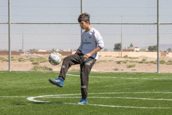 The soccer, weightlifting and other physical activities held at the child-friendly spaces help young refugees like Islam, 15, and Yousef, 15, expel stress and energy. Photo: Ezra Millstein/Mercy Corps