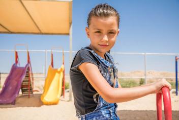 Proper clothing is important to keeping growing refugee children clean and healthy. Photo: Ezra Millstein/Mercy Corps