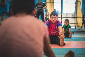 The soccer, weightlifting and other physical activities held at the child-friendly spaces help young refugees like Islam, 15, and Yousef, 15, expel stress and energy. Photo: Sean Sheridan/Mercy Corps