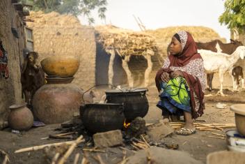 9:07 a.m. — Most of Badariya’s morning is spent cooking with her mother: finding wood, tending the fire and stirring the grains. “I also take some food to my grandmother, who is blind and can’t see,” she explains.